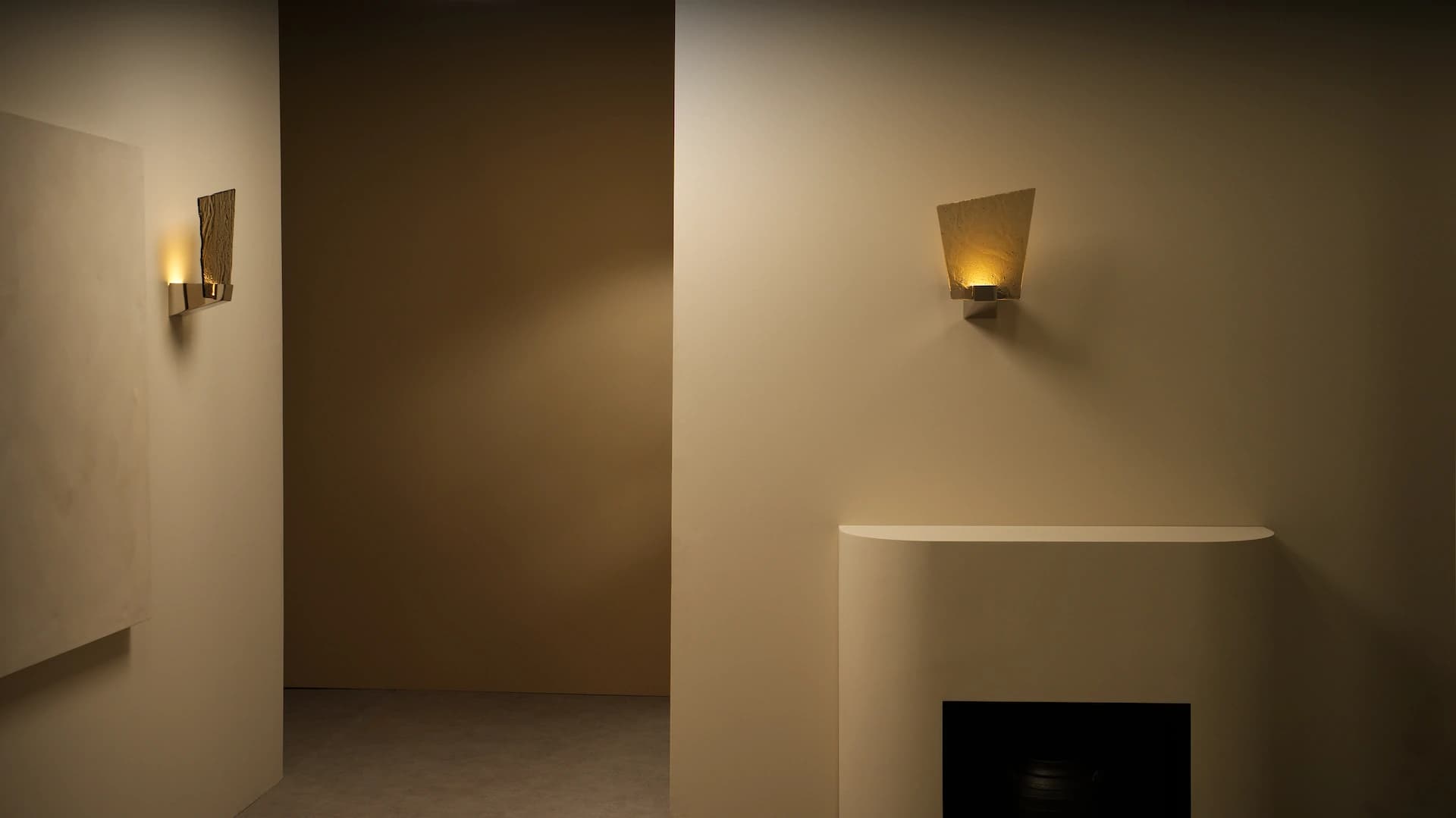Relic wall light with warm glow above mantle